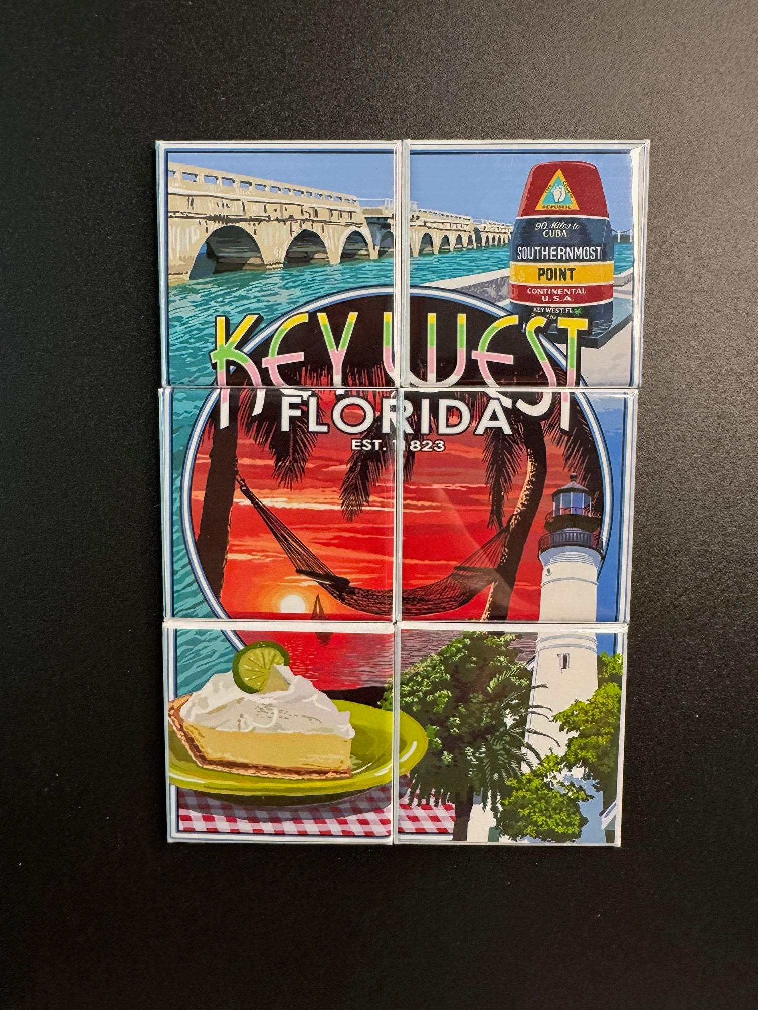 Key West, Florida-themed postcard set on a dark surface